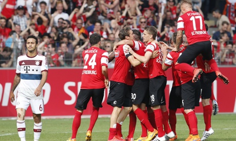 Freiburg's players celebrate after their win over Bayern Munich.