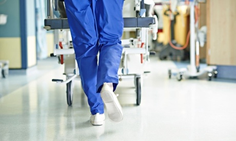 Legs of medic running with gurney 