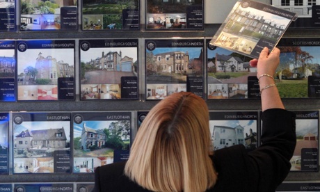 A woman looking at houses for sale in Edinburgh.