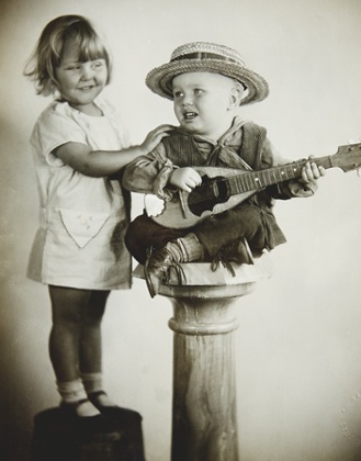 Mildren Kornman today, at 89 (below), and showing a youngster the ropes in Our Gang.