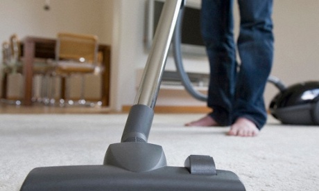 Man Using a Vacuum Cleaner