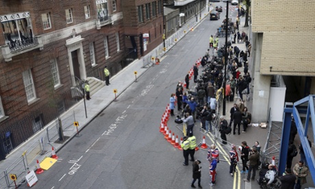 Numerous press doing literally the most pointless job in the world.