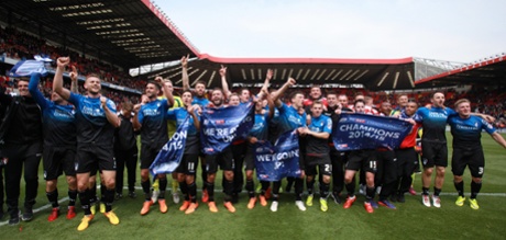 The Bournemouth players celebrate winning the Sky Bet Football League Championship.