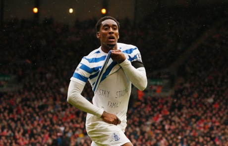 Wheels off in celebration and reveals a message on his t-shirt.