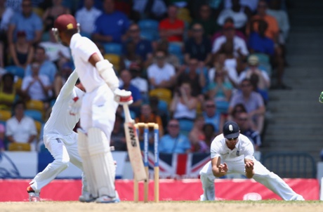 Alastair Cook of England takes a catch at first slip to claim the wicket of Shai Hope.