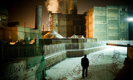 A man walks in the snow in the northern Iranian city of Mashhad.
