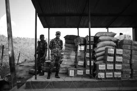 Provisions protected by soldiers on a road just outside Gorkha city, Nepal