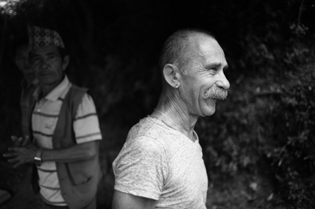 One of the group of tourists, Bob just after he had delivered the 25 kilo bag of rice which he carried on his back down the mountain 