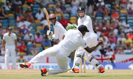 England's Chris Jordan takes the catch to dismiss West Indies' Shivnarine Chanderpaul off the bowling of Joe Root.