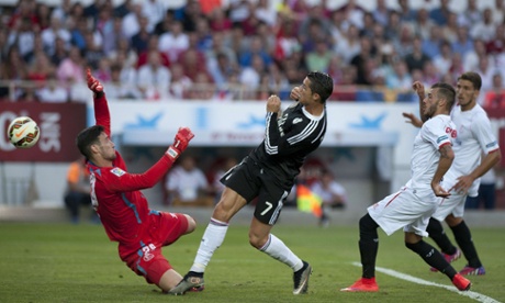 Ronaldo stabs the ball past Sevilla's goalkeeper Sergio Rico for his second goal of the game.