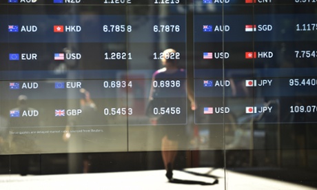 Foreign currency prices on display at a bank on a street in Sydney. 