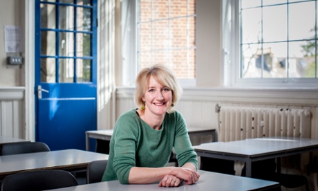 Anna Wright, sitting at a desk in her old place at school.