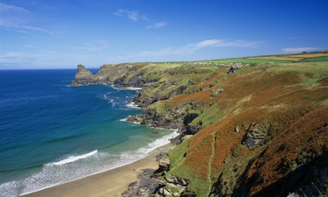 Sweeping coastline at Bossiney Haven in Cornwall with Trewethett Farm in the distance.