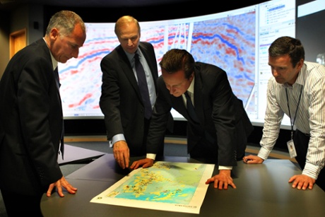 Prime Minister David Cameron (2nd right) with Regional President Trevor Garlick (left) BP Chief Executive Bob Dudley (2nd left) and Simon Richardson (right) Clair Reservoir Team Leader as they view an exploration map at BP North Sea Headquarters in Aberdeen.