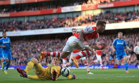 Sunderland's speedy goalkeeper Costel Pantilimon claims the ball ahead of Arsenal's Jack Wilshere.