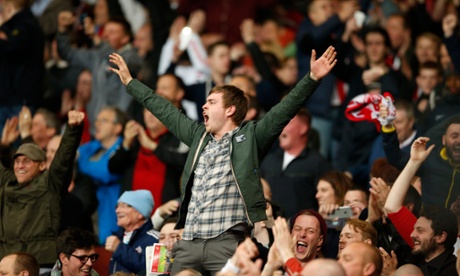 Some rather happy Black Cats fans.