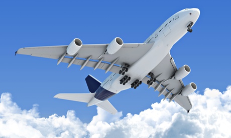 A plane taking off seen from underneath