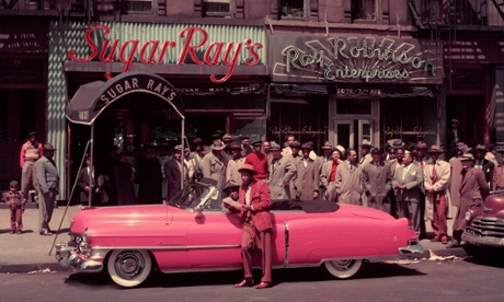 Boxer Sugar Ray Robinson with his 1950 pink Cadillac convertible in Harlem
