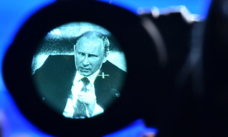 Vladimir Putin, seen through a viewfinder, at his annual press conference in Moscow in December 18, 2014.  Photograph: Kirill Kudryavtsev/AFP/Getty Images