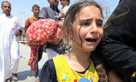 A girl and her family who escaped from the area controlled by the Islamic State (IS) militants in Ramadi, 20 May 2015.