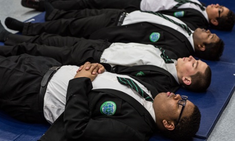 Teachers and pupils practice meditation techniques at Bethnal Green Academy