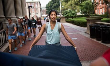 Emma Sulkowicz carrying the mattress around campus. The protest is also doubling as her senior thesis project.