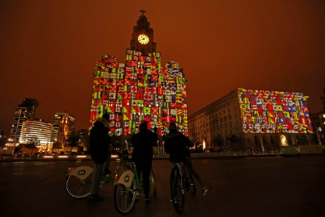 The Royal Liver Building and Cunard Building, right, on Liverpool's waterfront are lit up to mark the arrival of the shipping line's liners Queen Elizabeth, Queen Mary 2 and Queen Victoria.