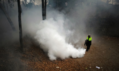 A municipal worker fumigates at Madreselva in San Salvador, El Salvador in 2013 after a dengue fever alert.