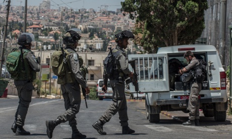 Israeli border police stand guard near the At-Tur junction, East Jerusalem, last Wednesday.