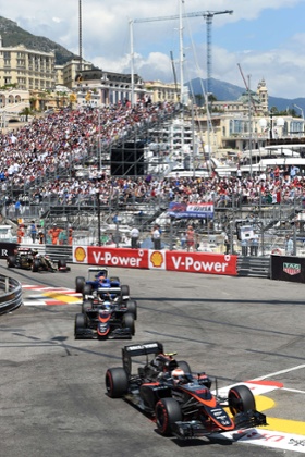 McLaren Honda's Jenson Button, Fernando Alonso and Sauber's Felipe Nasr negotiate the chicane.