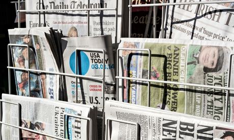 Newspapers for sale on a newspaper stand
