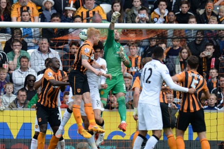 Manchester United's goalkeeper Victor Valdes comes for a punch from a cross and misses the ball - cue pandemonium in the United box.