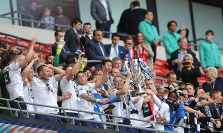 Preston North End's Tom Clarke and team mates lift the trophy after winning the Sky Bet League One Play Off final.