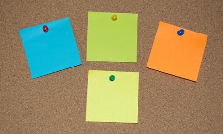 Close up of post it notes on a pinboard