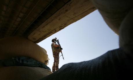 An Iraqi soldier in the Jurf al-Sakher area, some 50 kilometres south of Baghdad, to protect the region from further Isis gains following the fall of Ramadi.