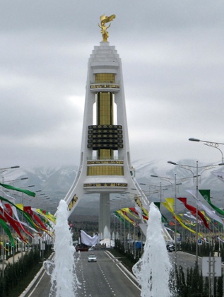 The golden statue of Turkmenistan's late dictator Saparmurat Niyazov on the top of a gigantic new monument after being moved from central Ashgabat to the outskirts of the city.