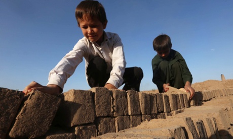 Young Afghan boys work at a brick kiln on the outskirts of Herat, Afghanistan. Due mainly to foreign aid the Afghan economy has shown signs of improvement.