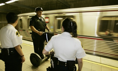 A transit officer patrols Union Station in Los Angeles – access to affordable buses and trails is vital to social mobility