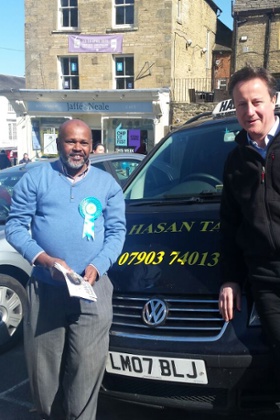 Taxi driver Tahirul Hasan with David Cameron in Chipping Norton.