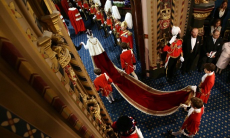 Queen Elizabeth II proceeds through the Royal Gallery during the State Opening of Parliament in the House of Lords at the Palace of Westminster.
