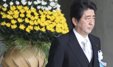 Shinzo Abe leaves   during a ceremony commemorating Japanese victims of the second world war   at Chidorigafuchi national cemetery in Tokyo on 25 May.