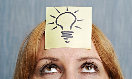 Woman with a drawing of a lightbulb on her head
