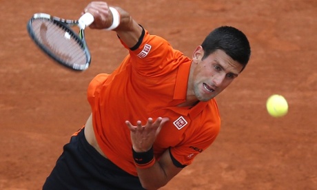 Novak Djokovic serves in his first-round match of the French Open against Jarkko Nieminen.