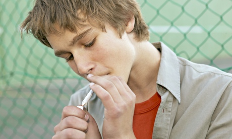 Teen boy smoking