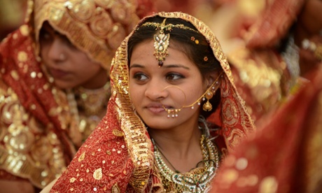 A young Indian Muslim bride during a mass wedding ceremony in Ahmedabad. Marrying girls off at an early age is common in rural areas.