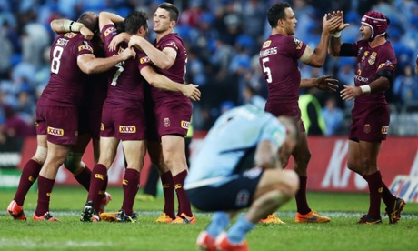 Queensland Maroons players celebrate victory after game one of the 2015 State of Origin series with the New South Wales Blues.