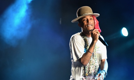 Pharrell Williams performs onstage in Philadelphia in one of his trademark hats
