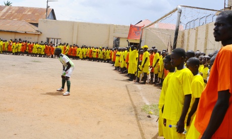 The Liverpool keeper stands in front of his goal and a packed crowd.