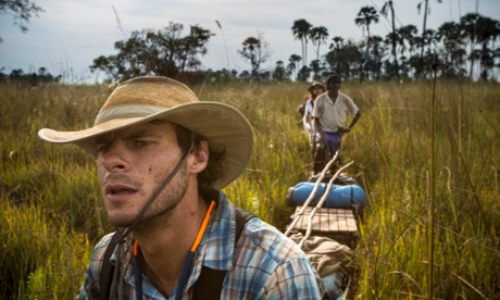 National Geographic Emerging Explorers Gregg Treinish and Jer Thorp, together with Lelamang Kgetho, pull their mokoro and supplies. When the water runs out, the team is forced to pull, sometimes for days.
