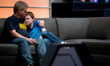 Zander Reed, 12, of Ames, Iowa, gets a kiss from his father, Todd, after incorrectly spelling his word during the 2015 Scripps National Spelling Bee.